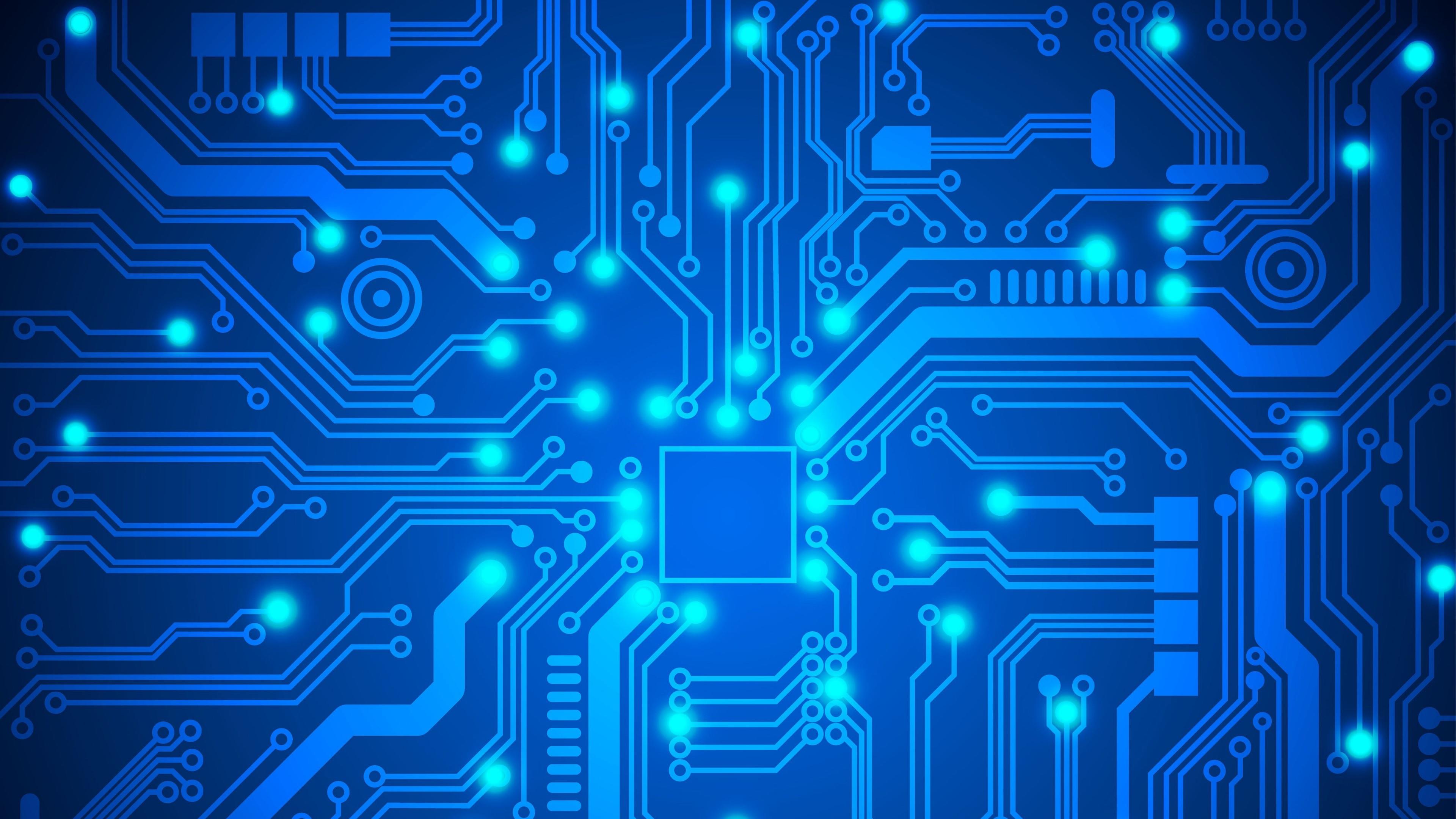 Blue semiconductor with circuits and balls of light at the ends of some of the circuits.